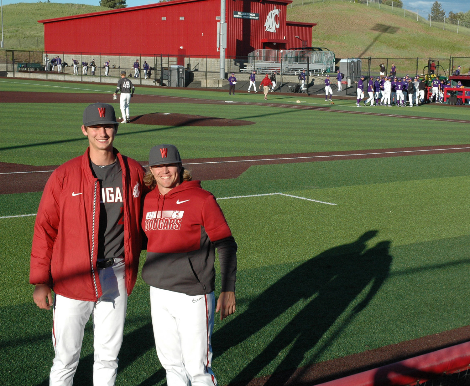 Washington State University's Brandon White (left) and Dakota Hawkins pose for a photo at Bailey-Brayton Field in Pullman after a win over the University of Washington on May 29.